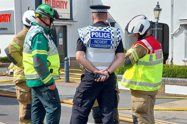 Police with fire and ambulance staff